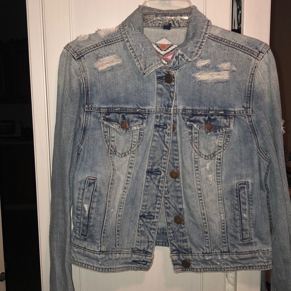 American Eagle jean jacket with pattern on back